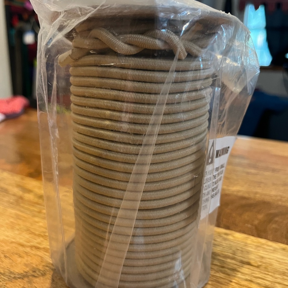 100 feet of 3/16 of an inch tan bungee cord unused spool
